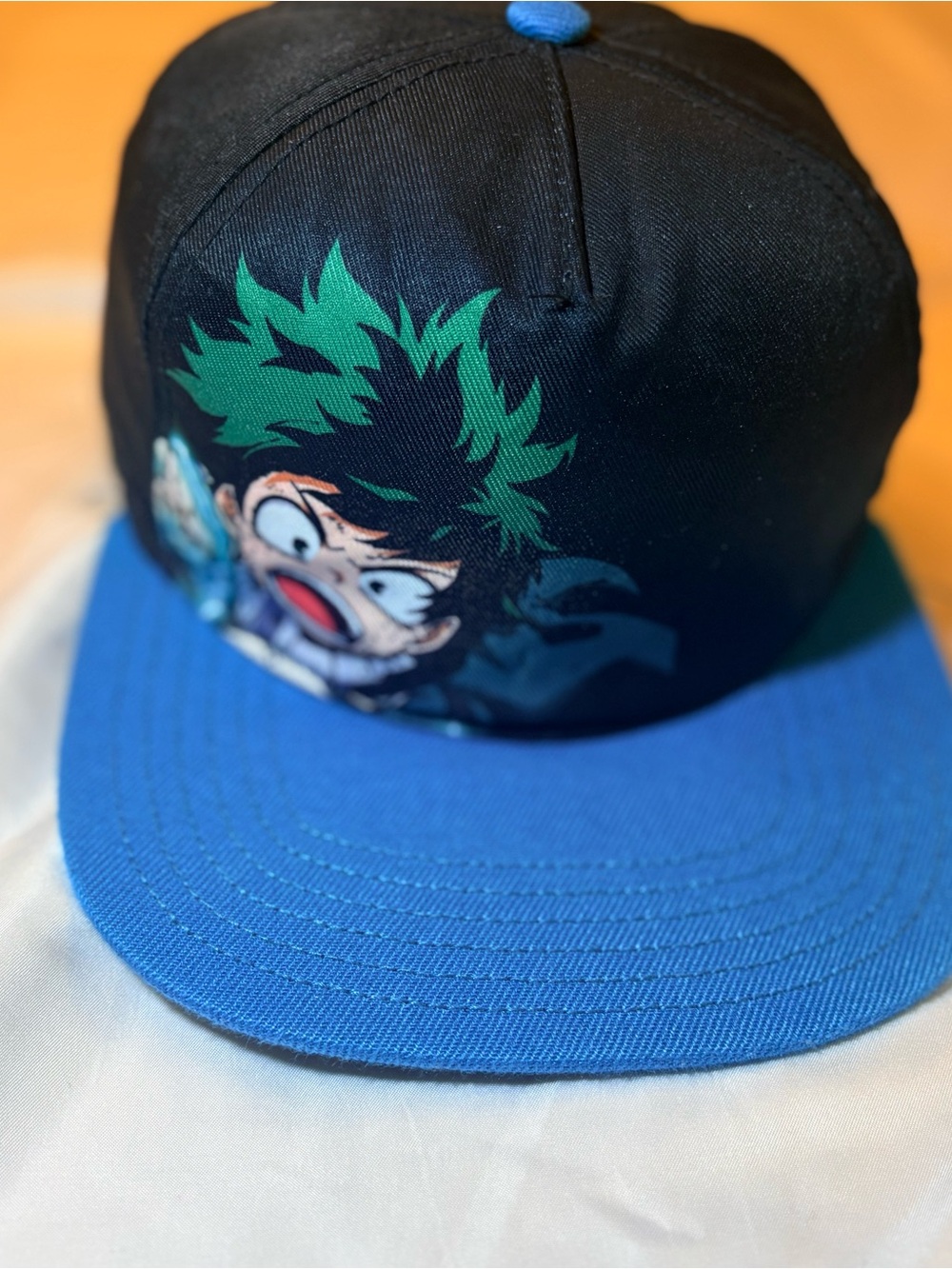 Kids Black and Blue Snapback Hat with Green Character Accent
